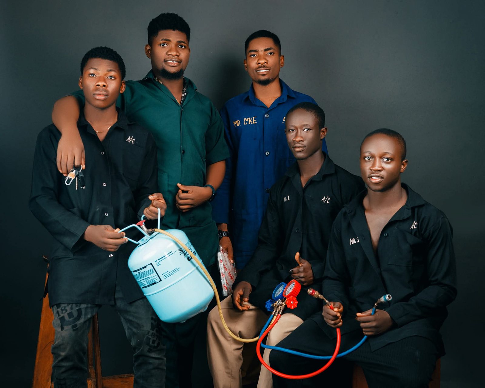 The GEIYKE A/C technician team with tools of the trade